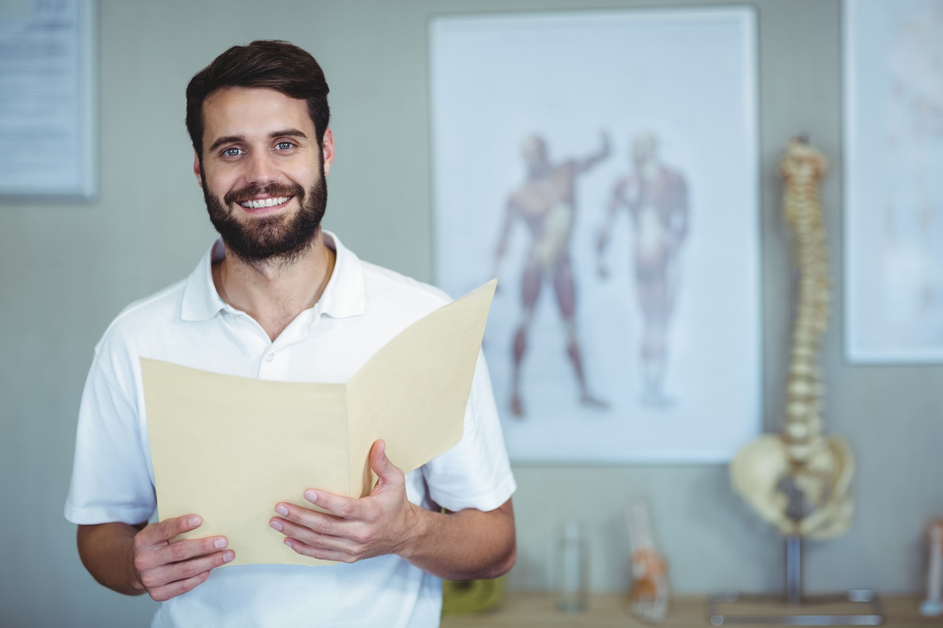 Portrait of physiotherapist holding file